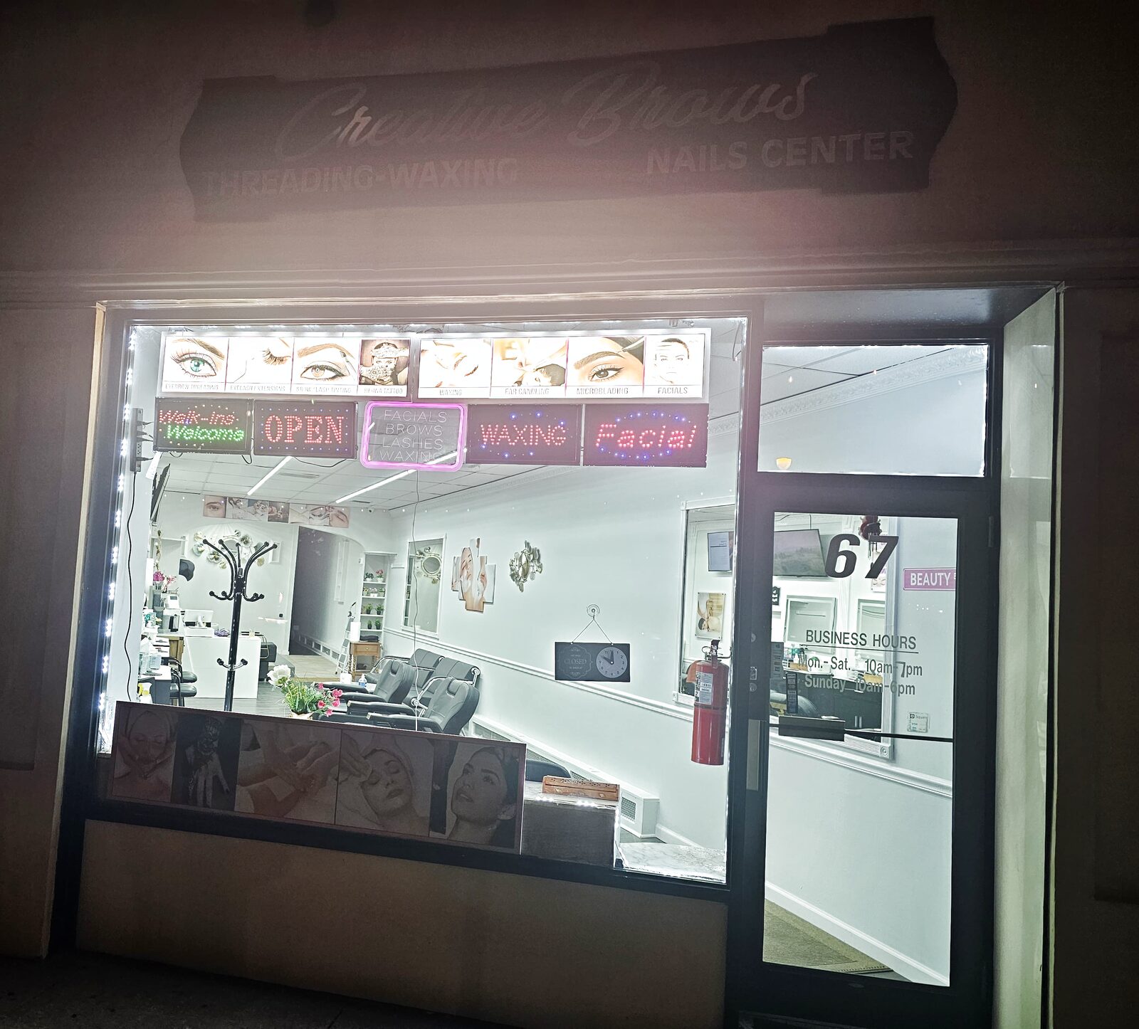 The Creative Brows storefront at 67 Atlantic Ave in Lynbrook, lit up in the evening
